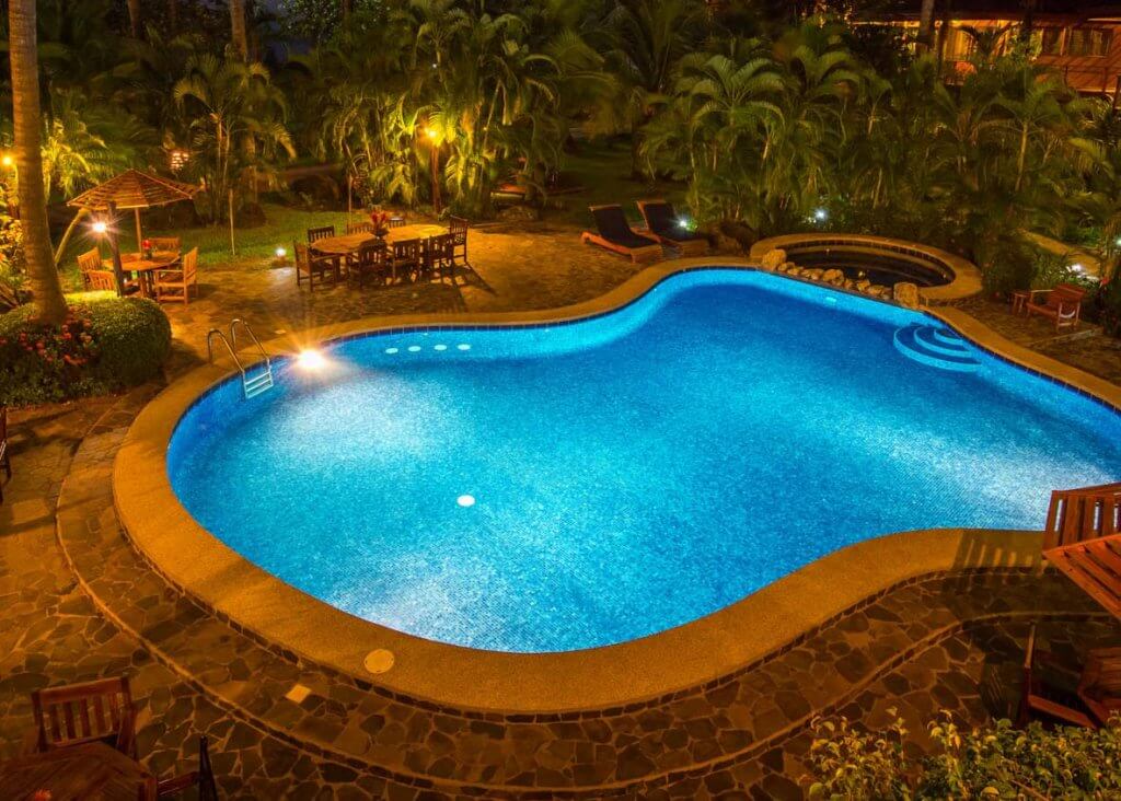 34-Tambor-Tropical-Beach-Resort-Tambor-Puntarenas-Costa-Rica-Tropical-Pool-at-Night Large freeform pool